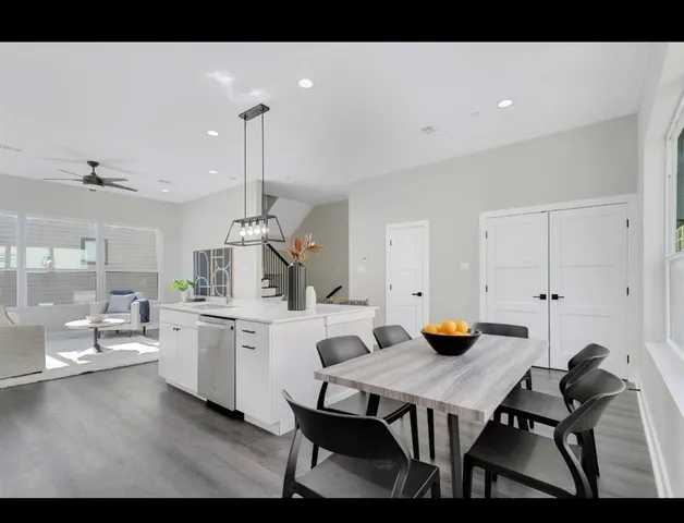 a view of a dining room with furniture and window