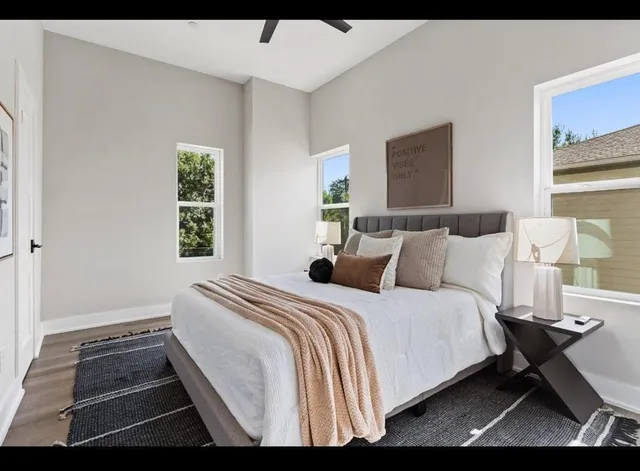 a bedroom with a bed window and floor