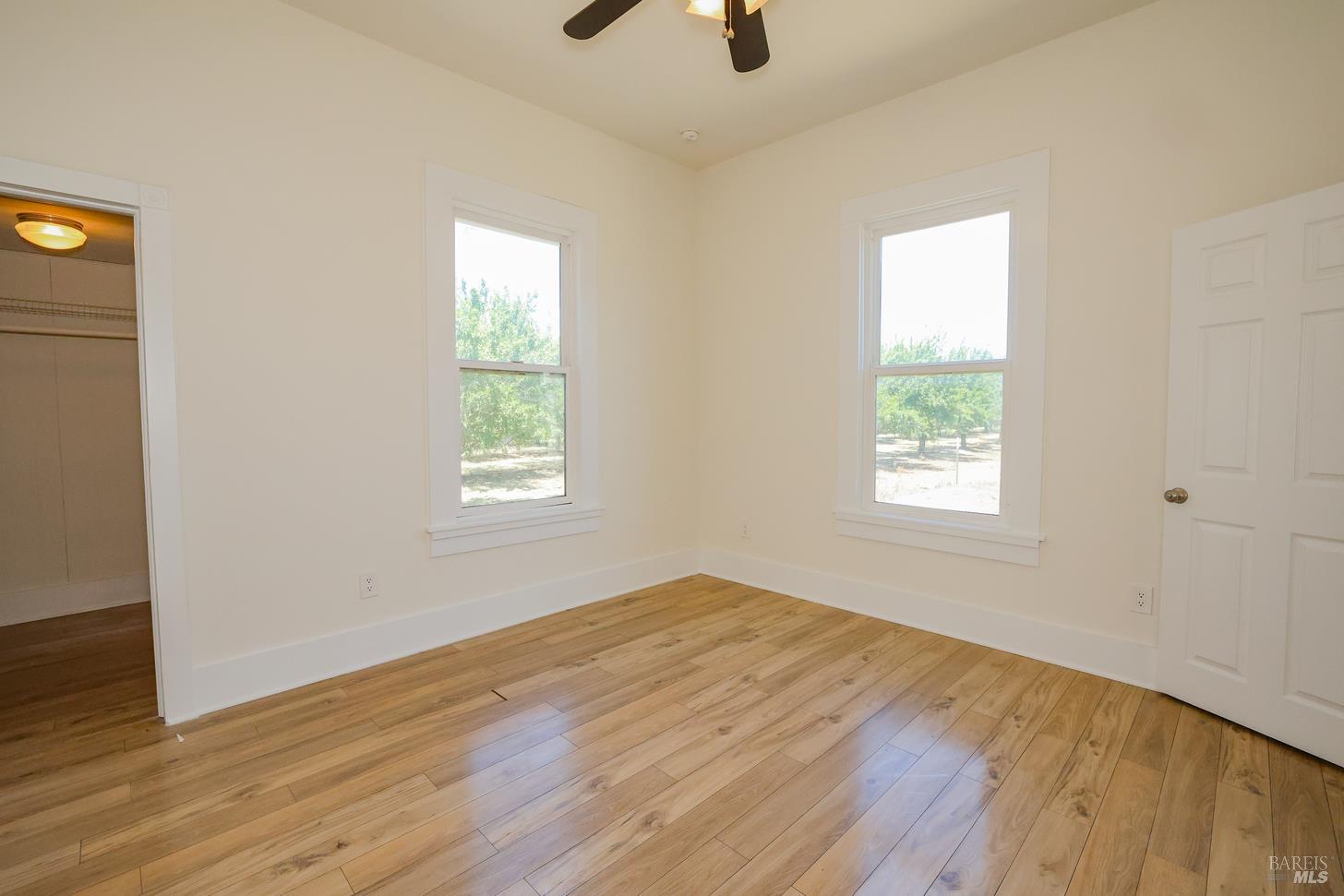 7948 North Meridian Road Dixon, CA 95620 - Photo 23 of 59 wooden floor in an empty room with a window