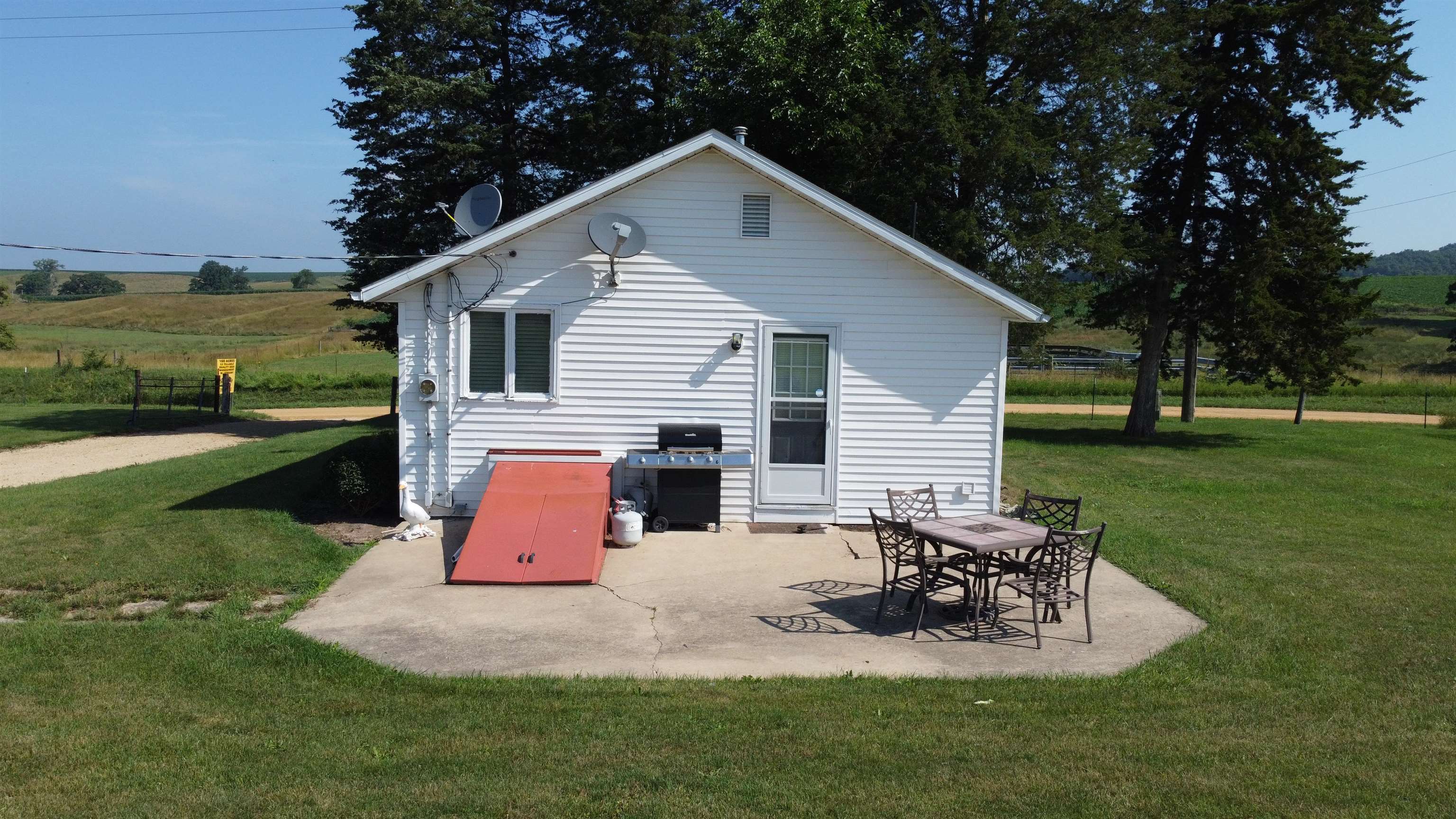 1735 West Steele Road Hanover, IL 61041 - Photo 41 of 70 a view of a house with a yard and sitting area