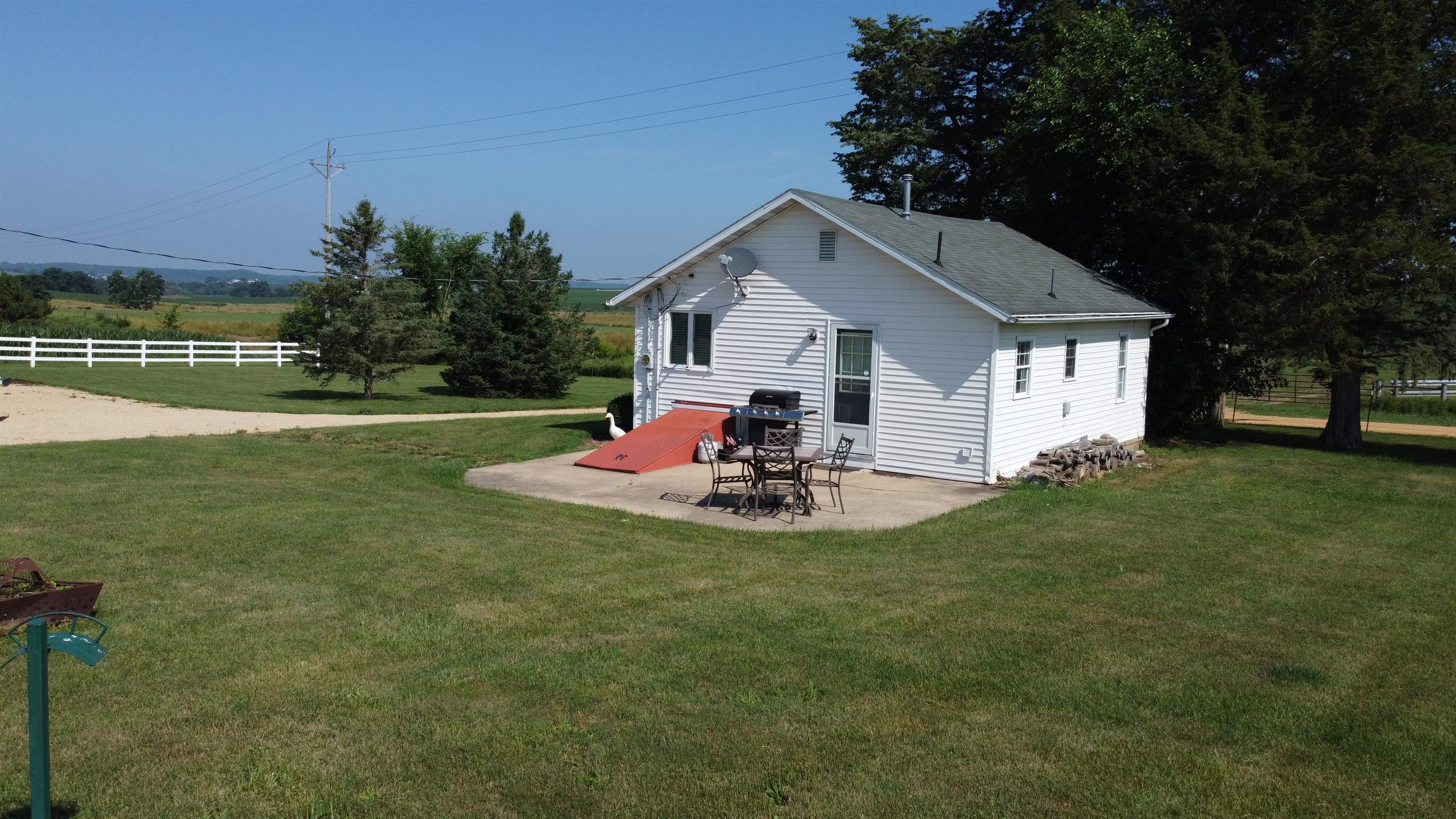 1735 West Steele Road Hanover, IL 61041 - Photo 8 of 70 a view of a house with backyard and trees