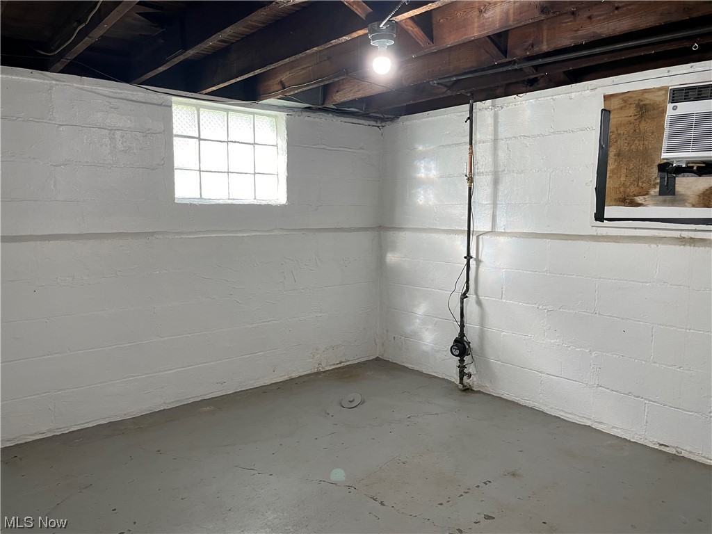 1730 Burgess Road Cleveland, OH 44112 - Photo 22 of 35 Second basement room featuring water meter and drain cleanout in floor.