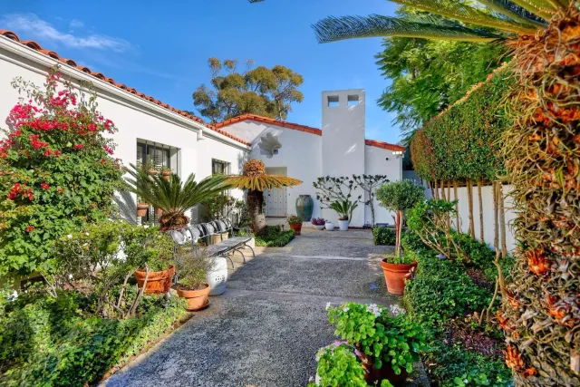 a view of a house with a tree