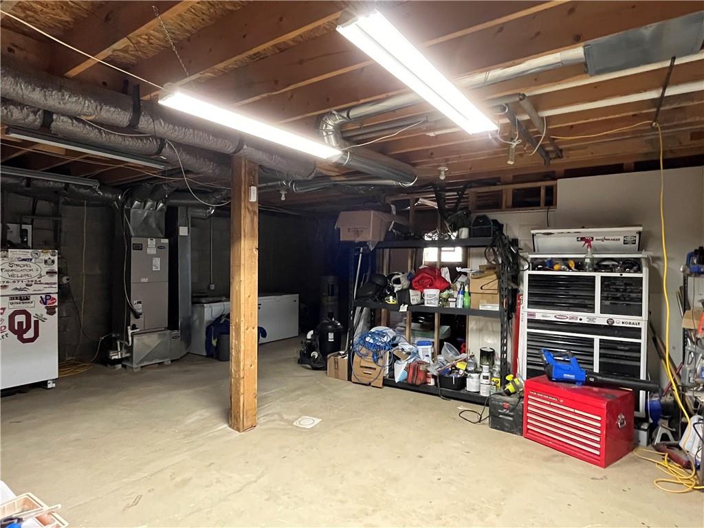 129 Maple Street Rices Landing, PA 15357 - Photo 16 of 18 a view of a storage room with racks shoes and chairs