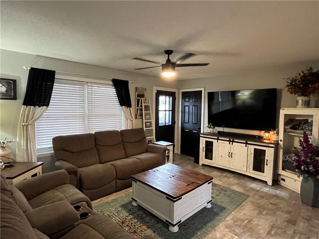 129 Maple Street Rices Landing, PA 15357 - Photo 8 of 18 a living room with furniture and a flat screen tv