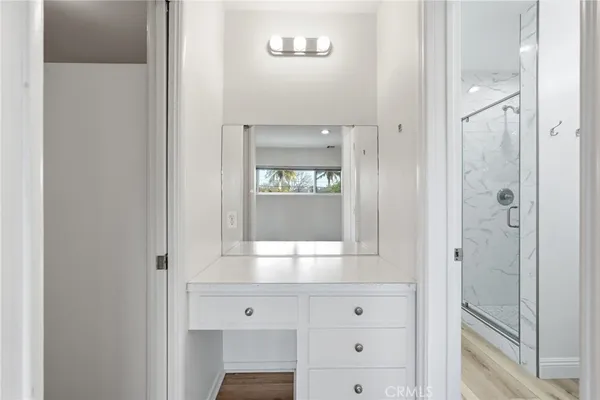 a view of bathroom with mirror