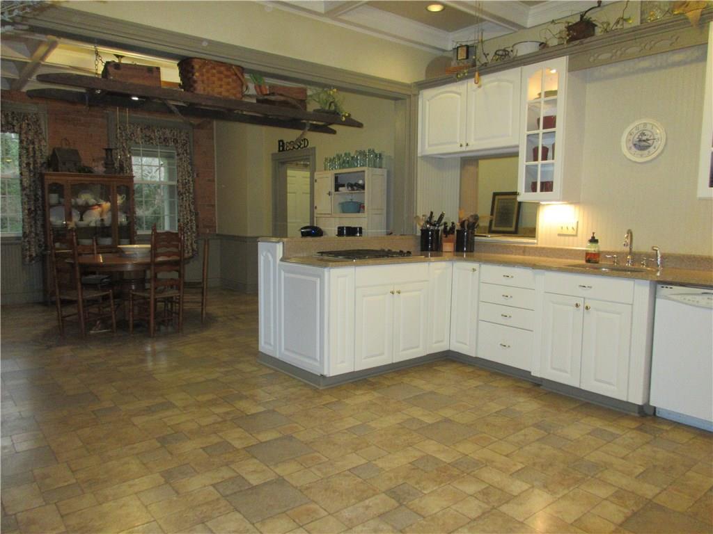 540 Freeport Road Freeport, PA 16229 - Photo 11 of 25 Huge eat-in kitchen with Vanguard countertops, a gas cooktop and double oven, coffered beamed ceilings with recessed lighting and ceiling fans with lights.
