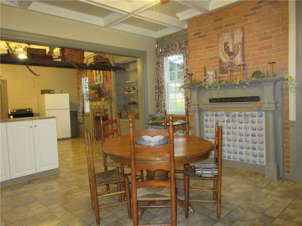 540 Freeport Road Freeport, PA 16229 - Photo 13 of 25 Huge eat-in kitchen with Vanguard countertops, a gas cooktop and double oven, coffered beamed ceilings with recessed lighting and ceiling fans with lights.