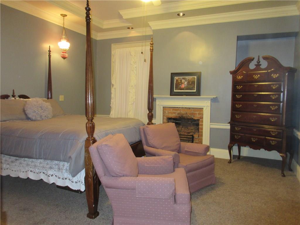 540 Freeport Road Freeport, PA 16229 - Photo 15 of 25 Master bedroom with tray ceiling, crown molding, recessed lighting and ceiling fan light, and a walk in closet.
