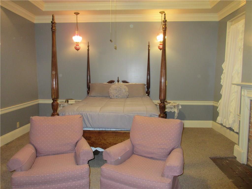 540 Freeport Road Freeport, PA 16229 - Photo 16 of 25 Master bedroom with tray ceiling, crown molding, recessed lighting and ceiling fan light, and a walk in closet.