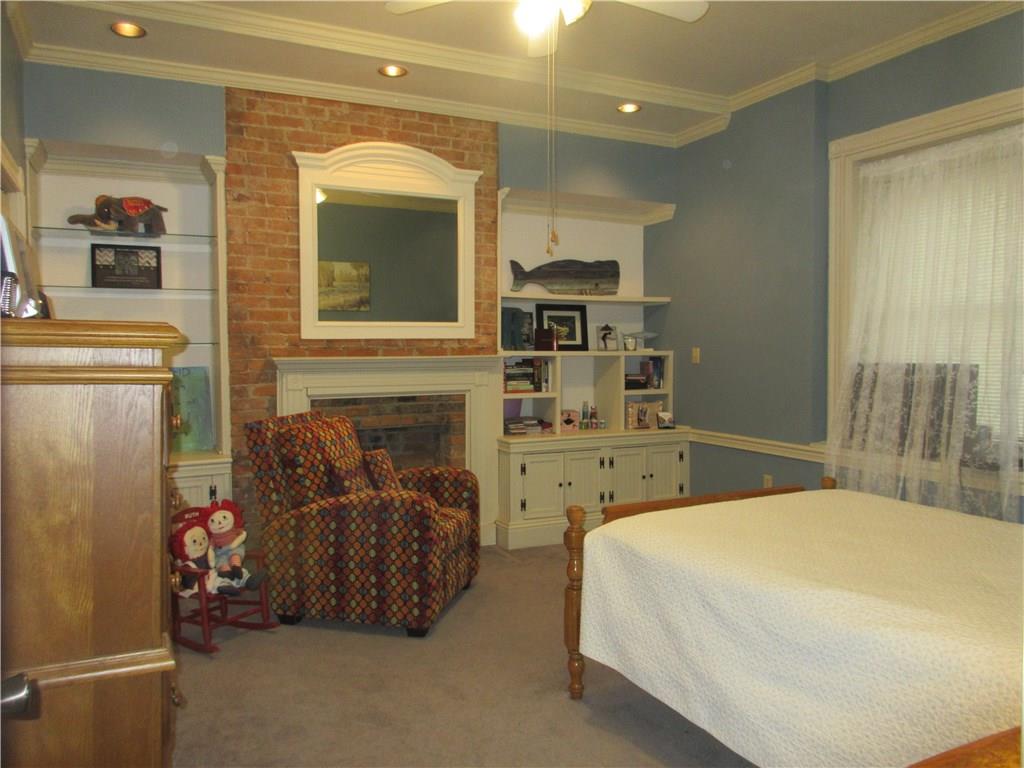 540 Freeport Road Freeport, PA 16229 - Photo 17 of 25 Bedroom 2 with crown molding, recessed lighting, ceiling fan light, and double closet. Beautiful mantle mirror stays.