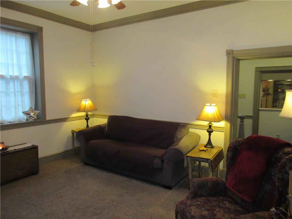 540 Freeport Road Freeport, PA 16229 - Photo 6 of 25 Living room with built-ins, ceiling fan with light, and crown molding.