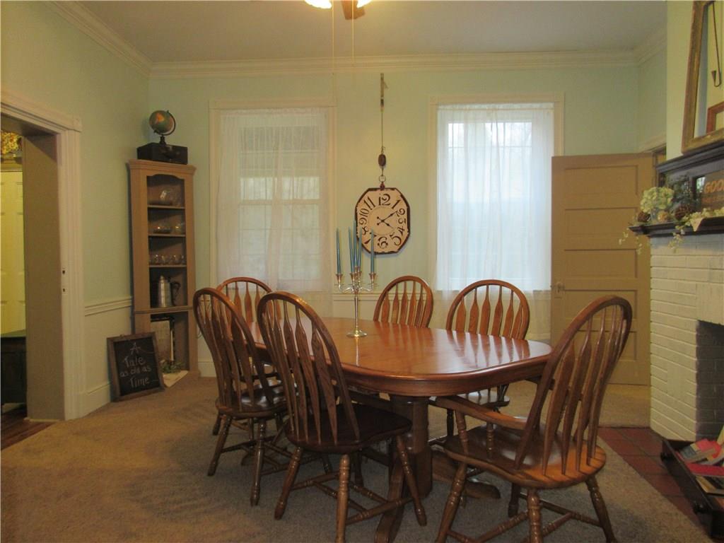 540 Freeport Road Freeport, PA 16229 - Photo 8 of 25 Dining room with crown molding, ceiling fan with light and built-ins.