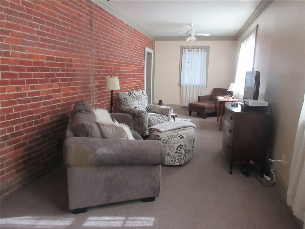 540 Freeport Road Freeport, PA 16229 - Photo 10 of 25 Family room with crown molding, 2 ceiling fans with lights, and 2 double closets.