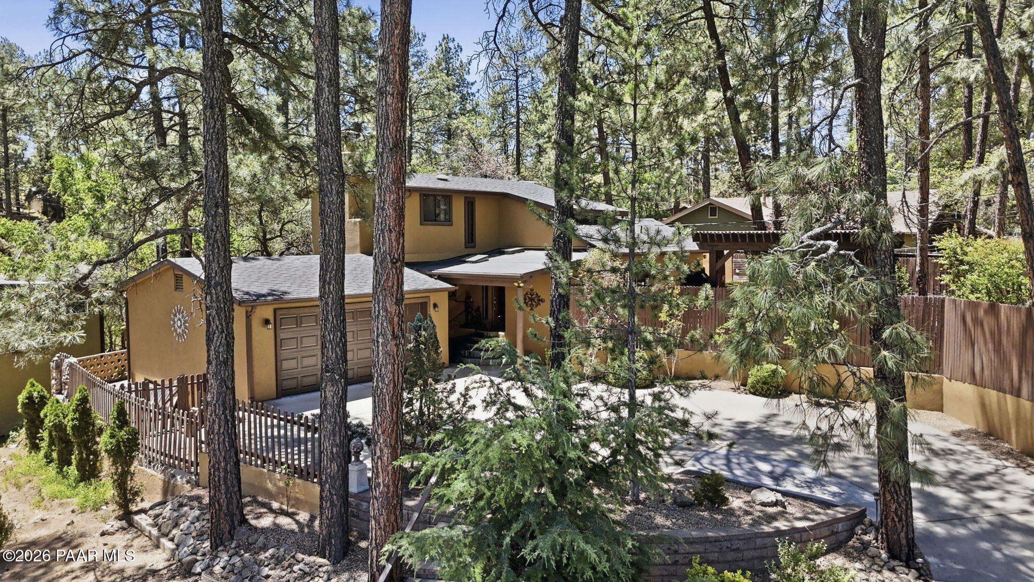 535 Copper Basin Road Prescott, AZ 86303 - Photo 2 of 41 a backyard of a house with table and chairs