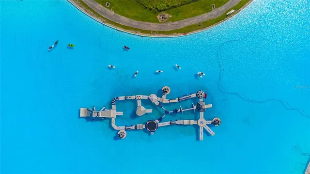 a room with table chairs and wooden floor
