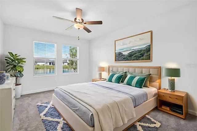 a bedroom with a large bed and a window