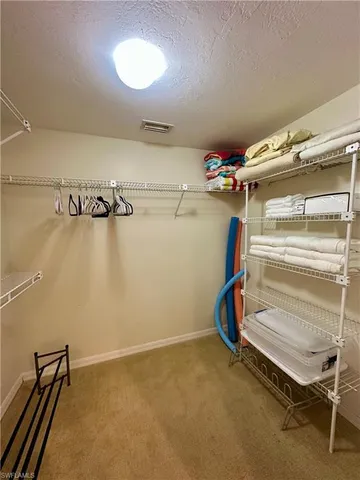 a view of a room with racks on the wall