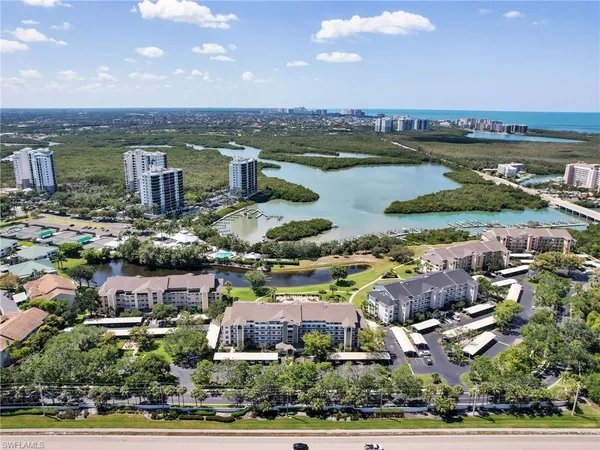 an aerial view of a houses with a lake view