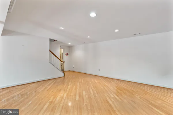 a view of a dining room and hall with wooden floor