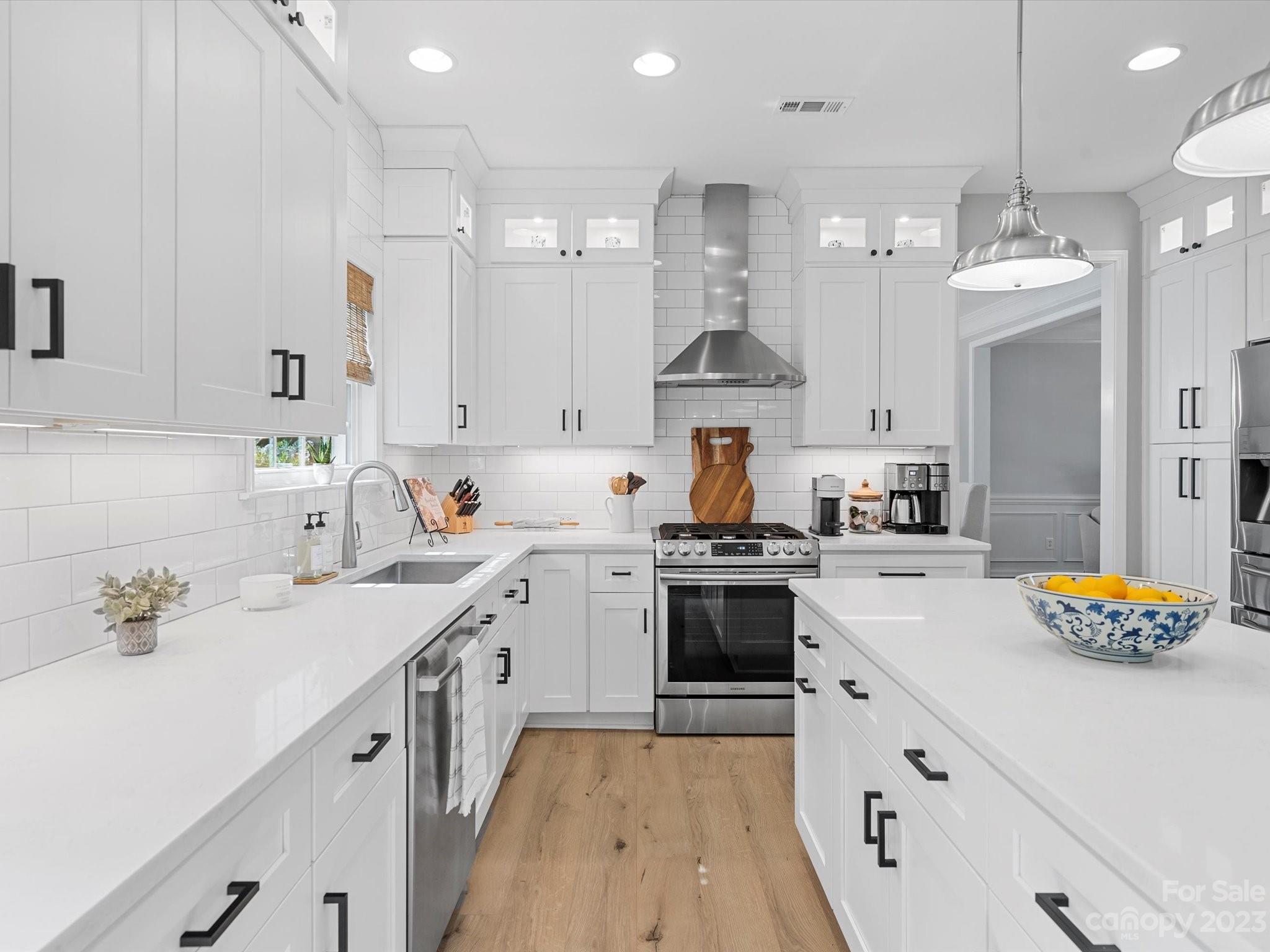 815 Circle Trace Road Monroe, NC 28110 - Photo 13 of 48 a kitchen with stainless steel appliances a sink stove and white cabinets