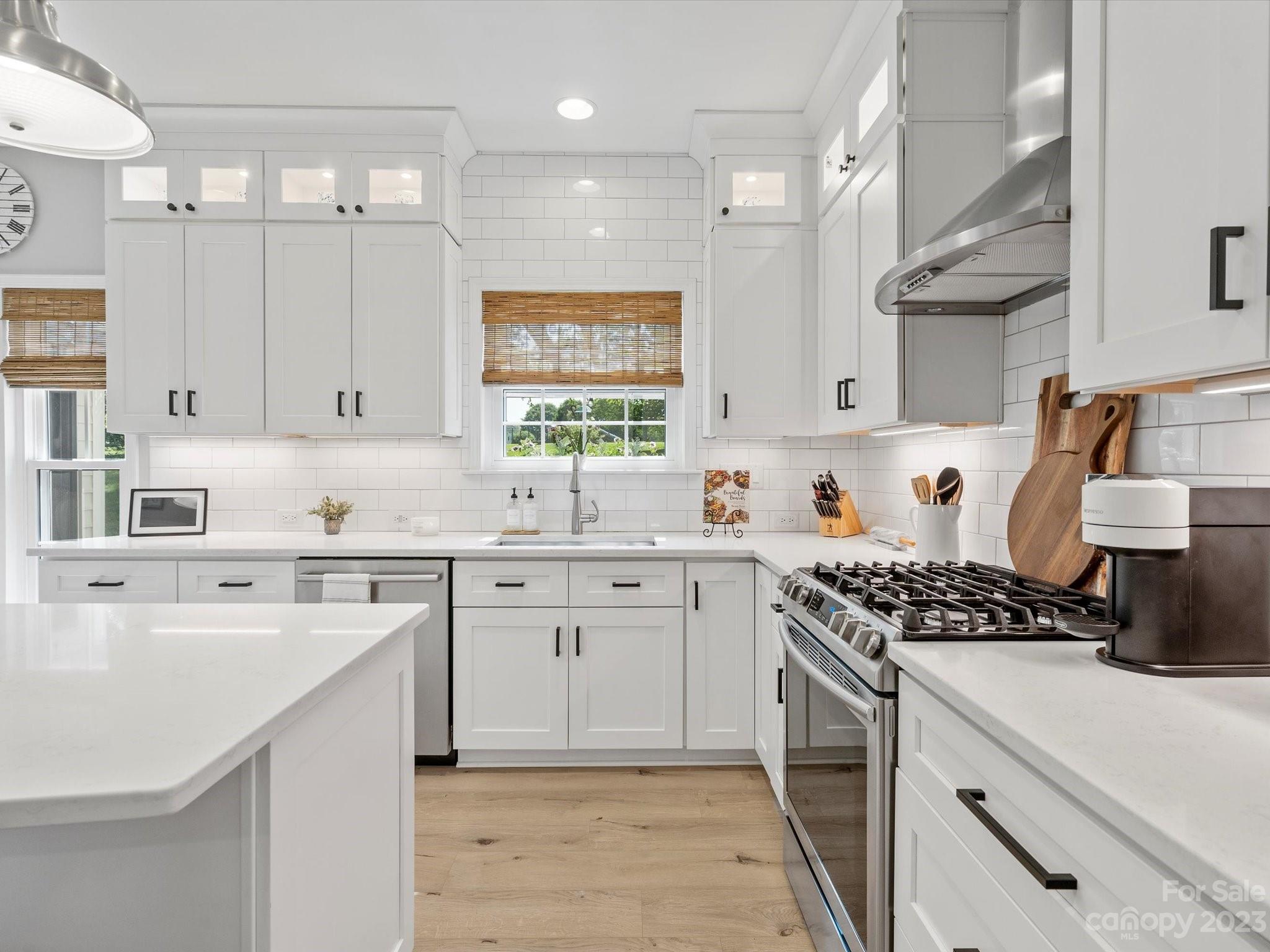 815 Circle Trace Road Monroe, NC 28110 - Photo 14 of 48 a kitchen with stainless steel appliances a sink stove and cabinets