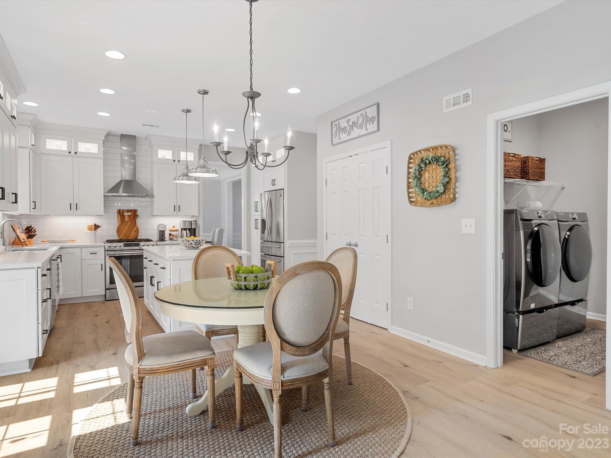 815 Circle Trace Road Monroe, NC 28110 - Photo 18 of 48 a dining room with furniture and a chandelier