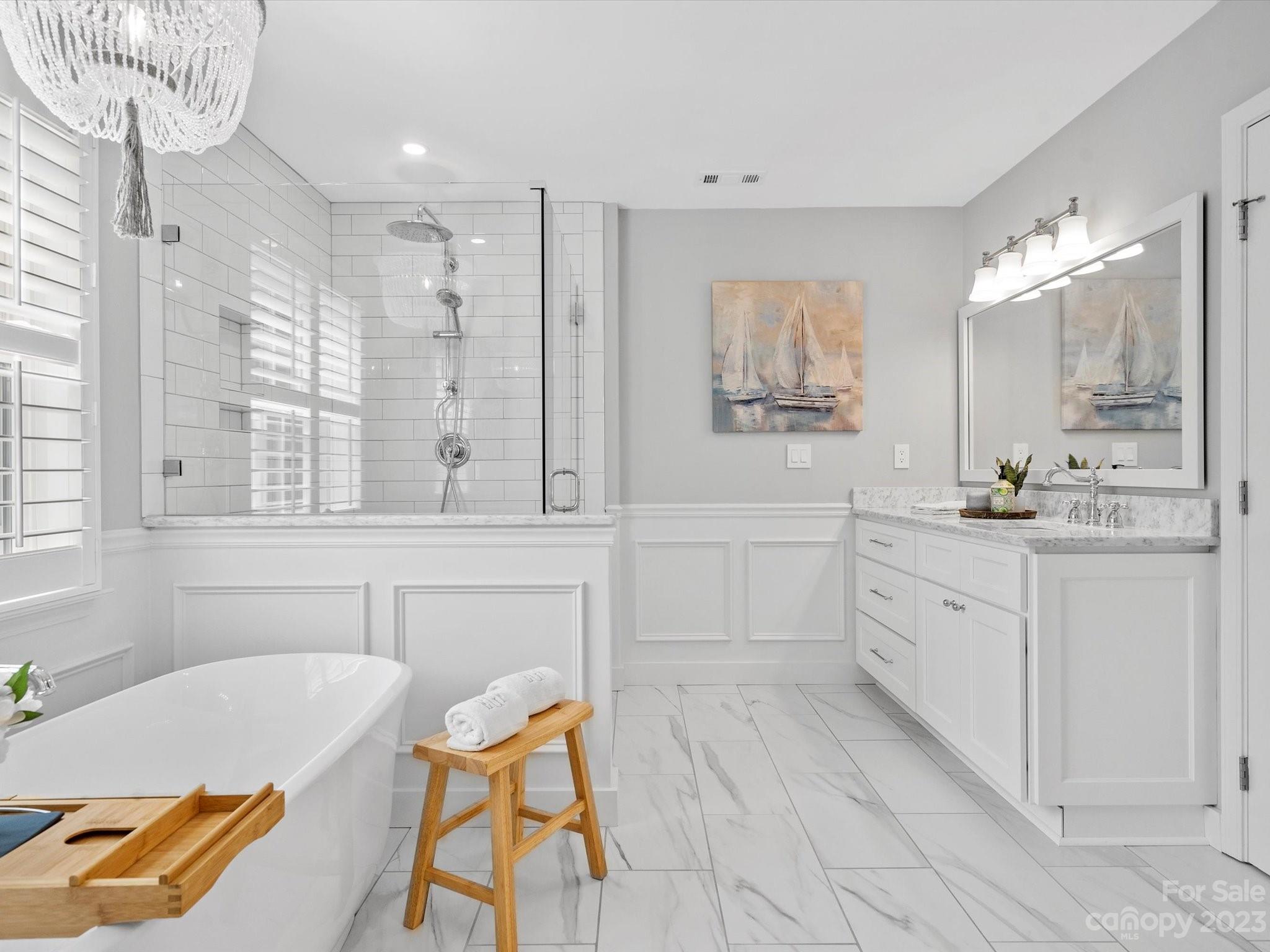 815 Circle Trace Road Monroe, NC 28110 - Photo 28 of 48 a spacious bathroom with a tub sink and mirror