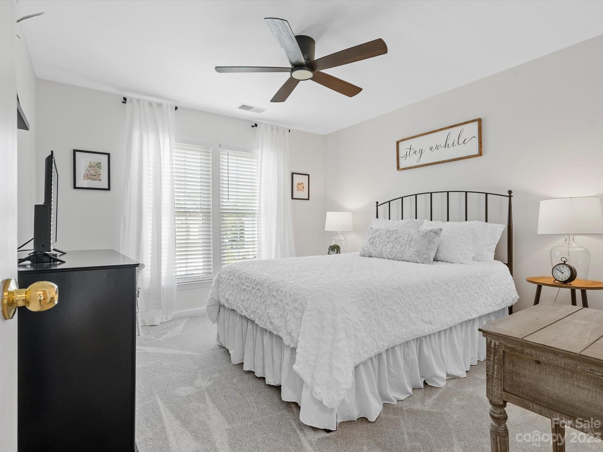 815 Circle Trace Road Monroe, NC 28110 - Photo 33 of 48 a bedroom with a bed and a chandelier