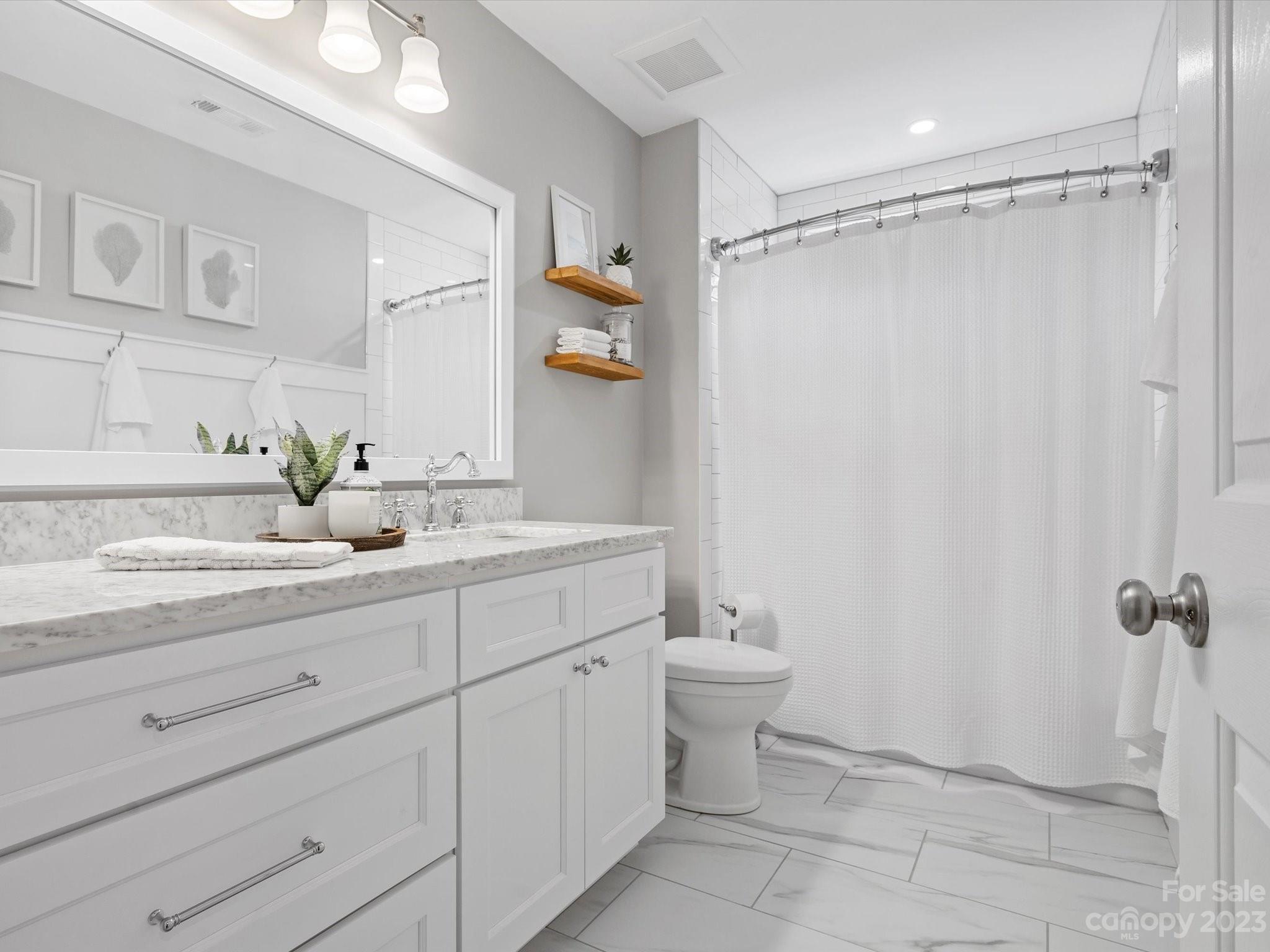 815 Circle Trace Road Monroe, NC 28110 - Photo 34 of 48 a bathroom with a shower sink vanity and toilet