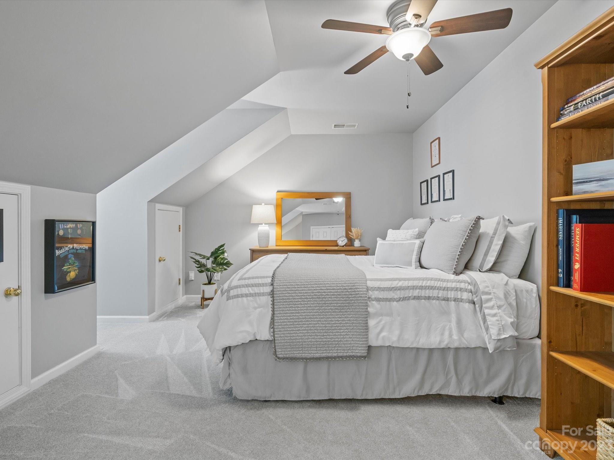 815 Circle Trace Road Monroe, NC 28110 - Photo 39 of 48 a bedroom with a bed and a chandelier