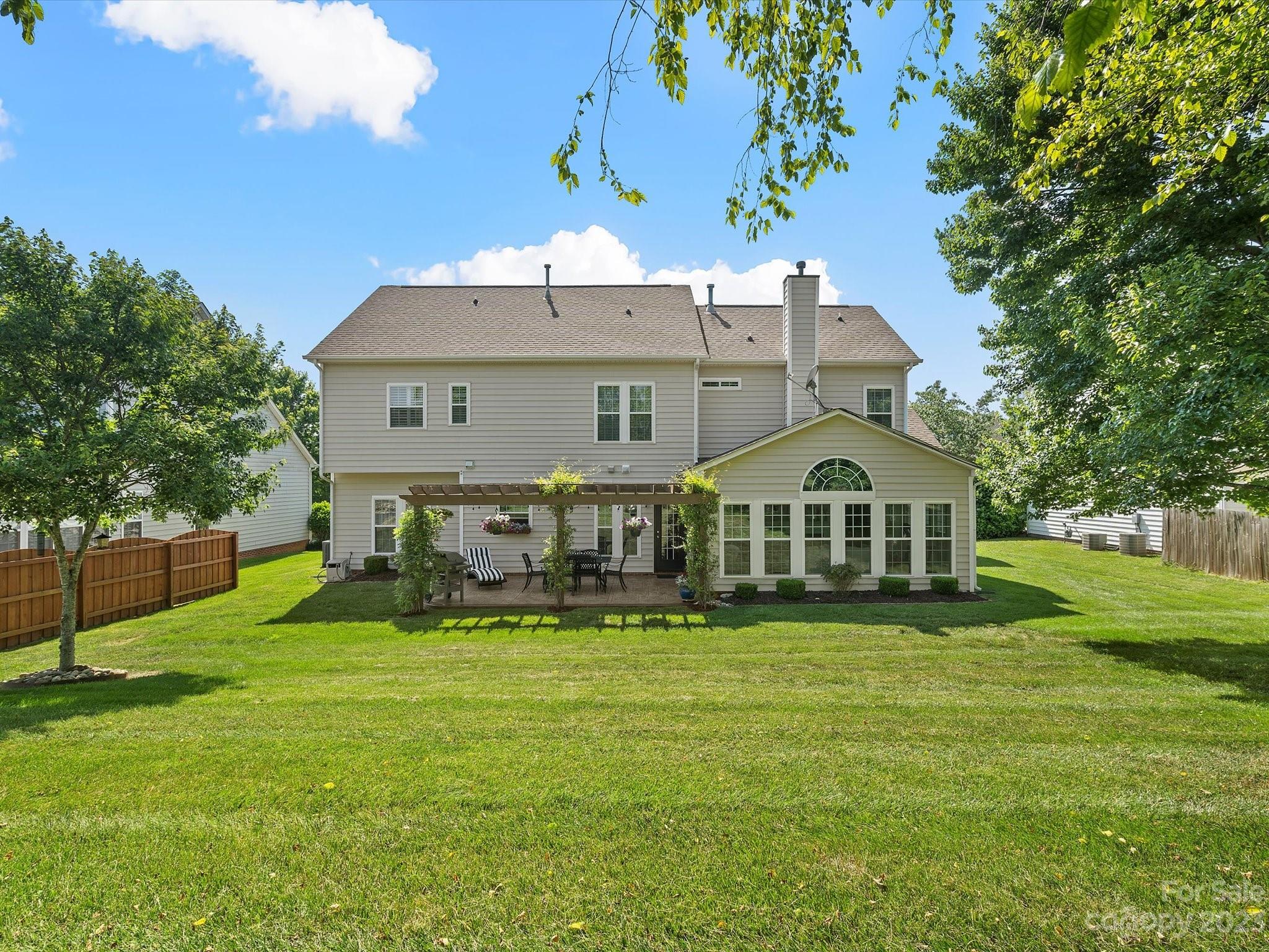 815 Circle Trace Road Monroe, NC 28110 - Photo 45 of 48 a large house with a big yard and large trees