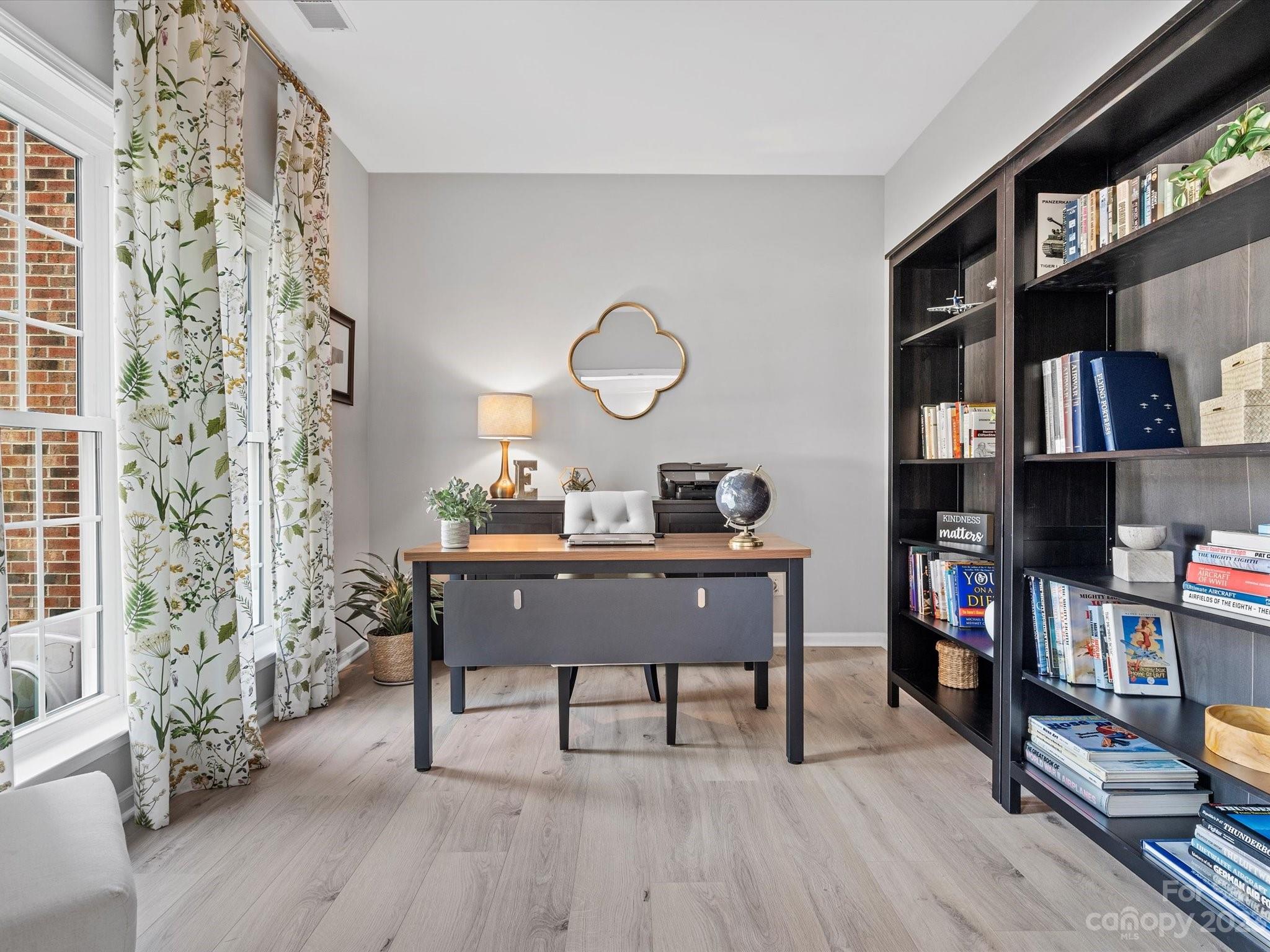815 Circle Trace Road Monroe, NC 28110 - Photo 5 of 48 a view of a workspace with furniture and wooden floor