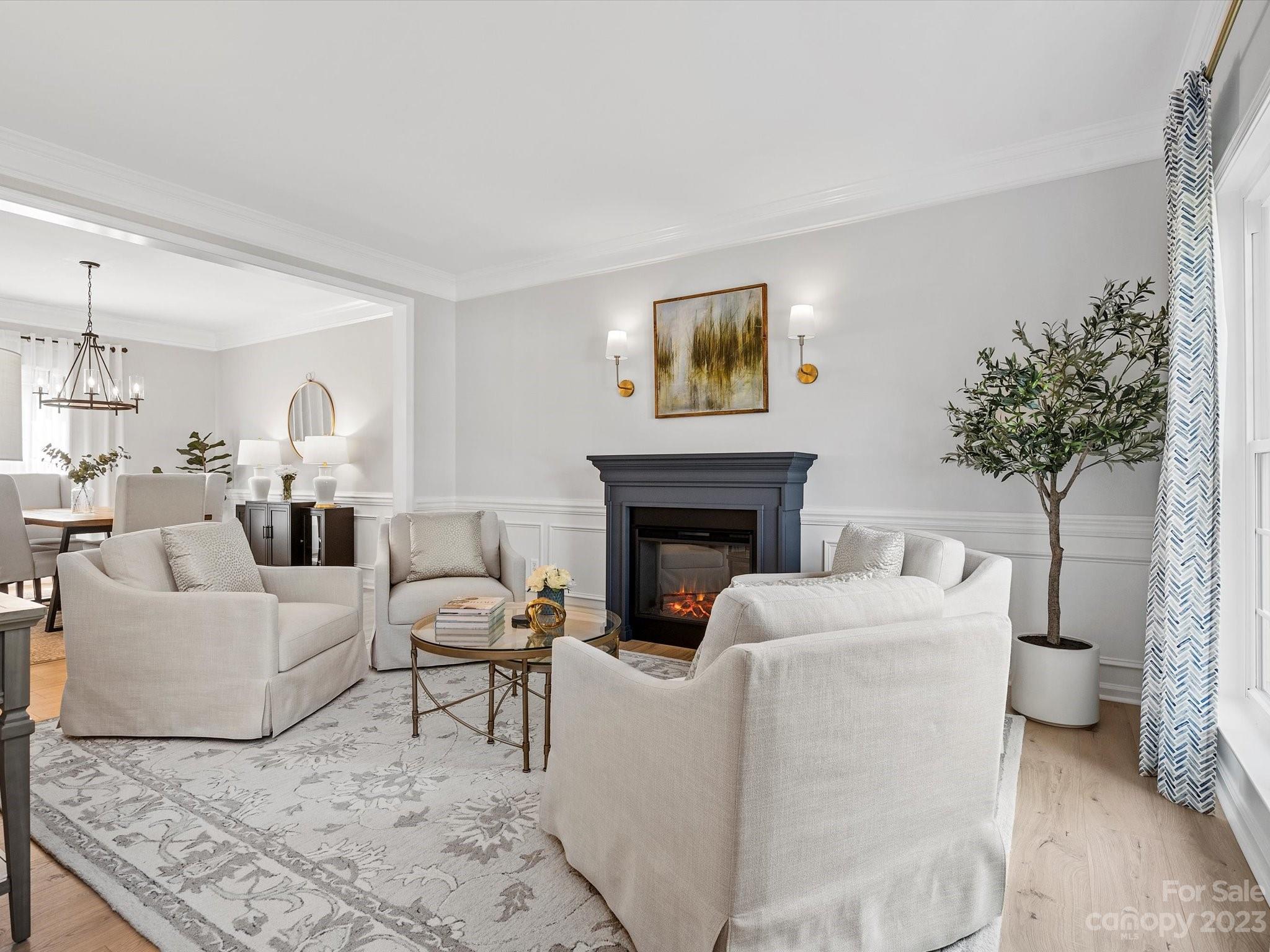 815 Circle Trace Road Monroe, NC 28110 - Photo 6 of 48 a living room with furniture a fireplace and a potted plant