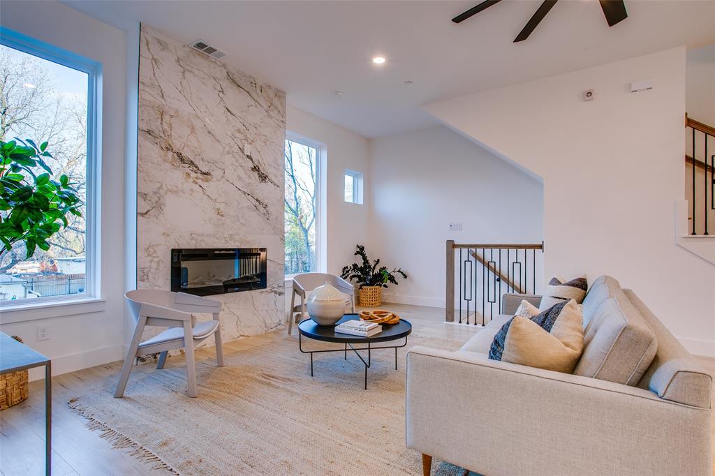2130 Shea Road, Unit 1002 Dallas, TX 75235 - Photo 11 of 39 a living room with furniture and a fireplace