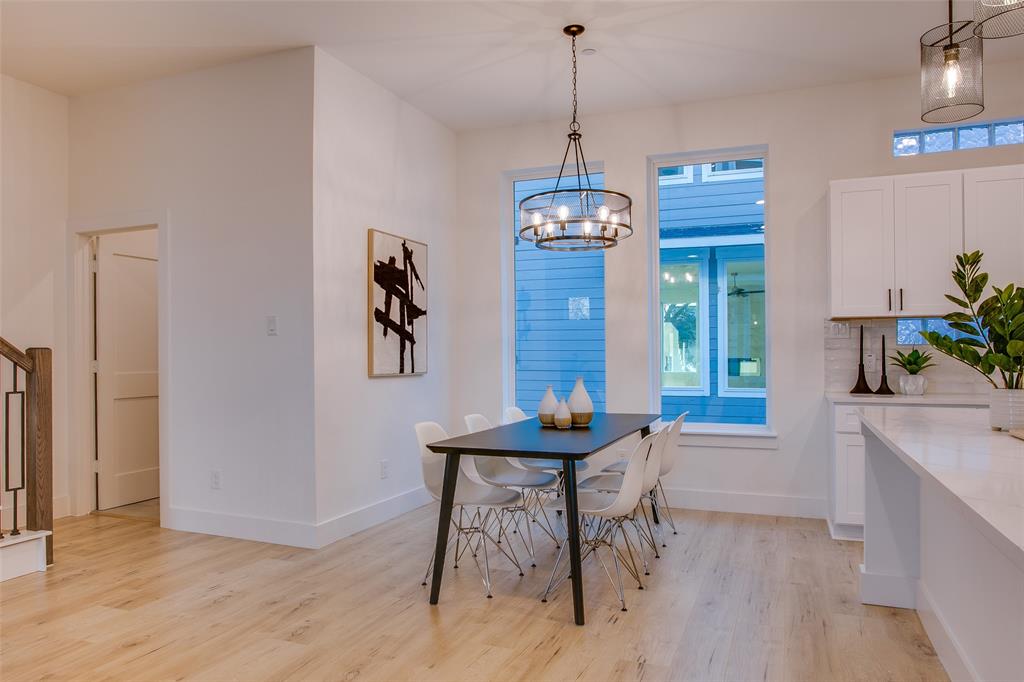 2130 Shea Road, Unit 1002 Dallas, TX 75235 - Photo 21 of 39 a view of a room with furniture window and wooden floor