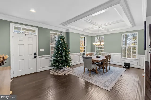 a living room with furniture window and wooden floor