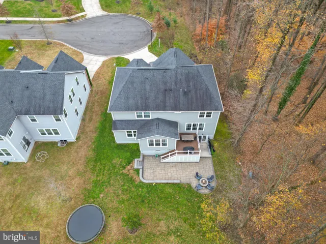a aerial view of a house with table and chairs