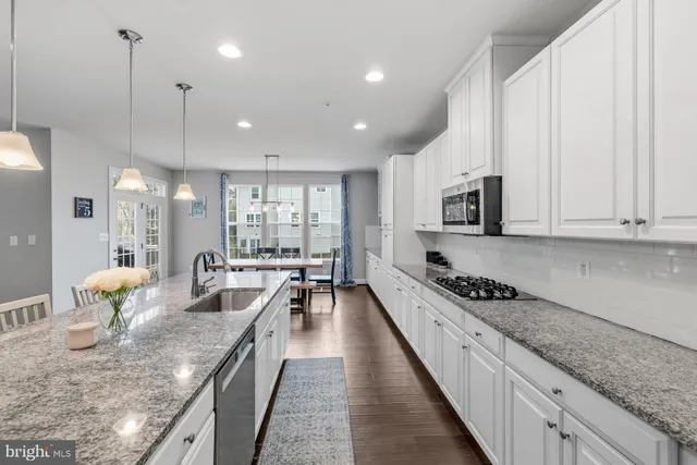 a view of a bedroom with baby crib and furniture