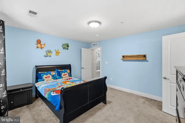 a bathroom with a granite countertop sink toilet a mirror and shower