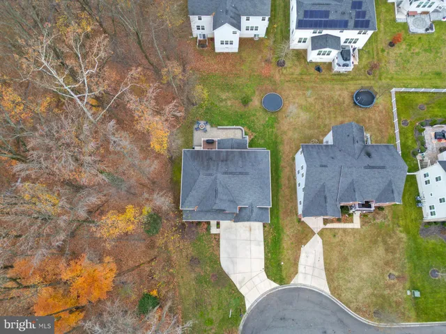 an aerial view of a house with yard