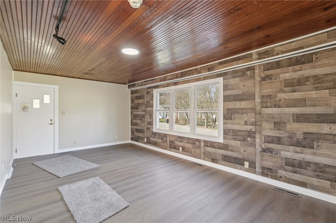 4200 Hattrick Road Rootstown, OH 44272 - Photo 7 of 42 Foyer entrance featuring wood finished floors and wood walls