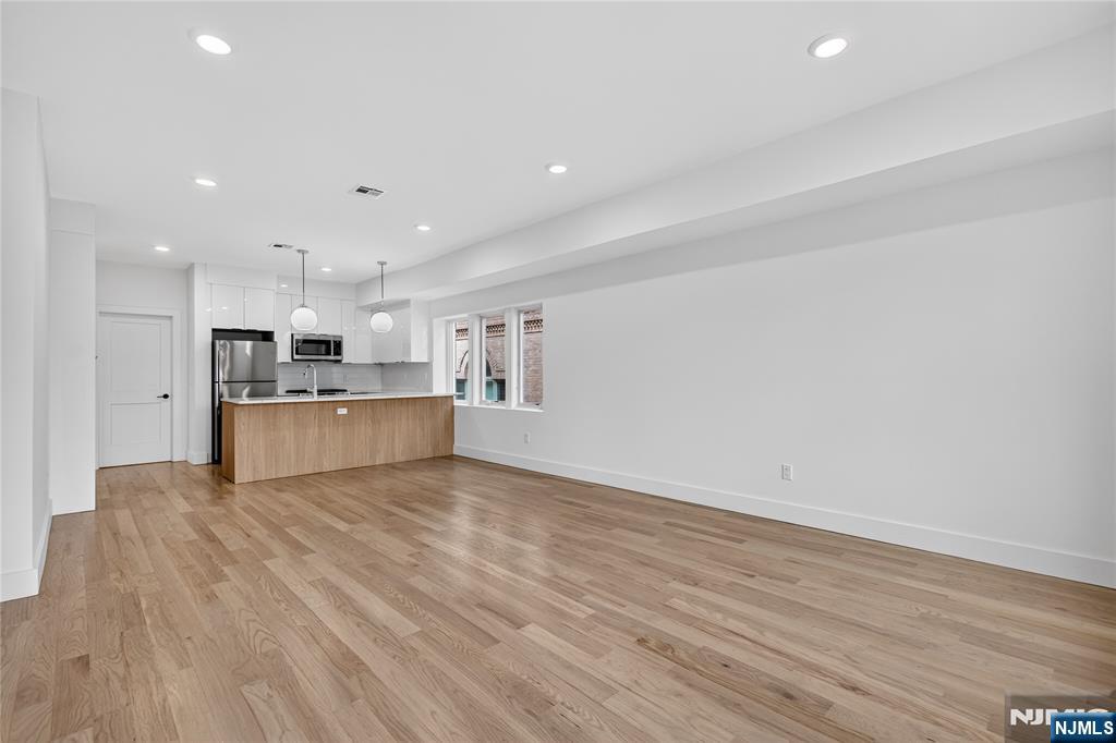 46 Hudson Avenue, Unit B Edgewater, NJ 07020 - Photo 3 of 30 a view of kitchen with wooden floor