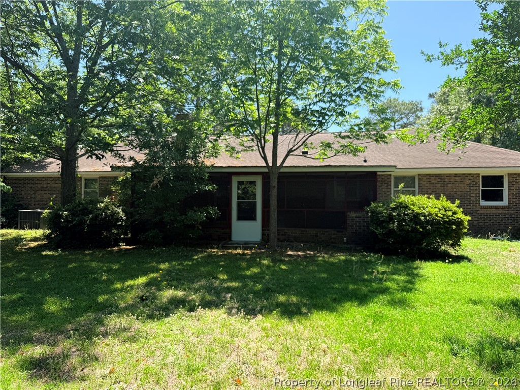 425 Dunmore Road Fayetteville, NC 28303 - Photo 19 of 21 a front view of a house with a garden and trees