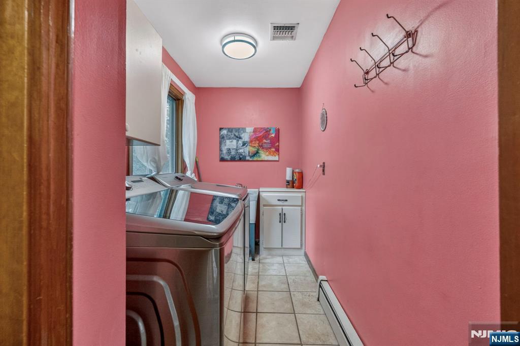 5110 Berkshire Valley Road Oak Ridge, NJ 07438 - Photo 21 of 49 a view of a hallway with washer and dryer