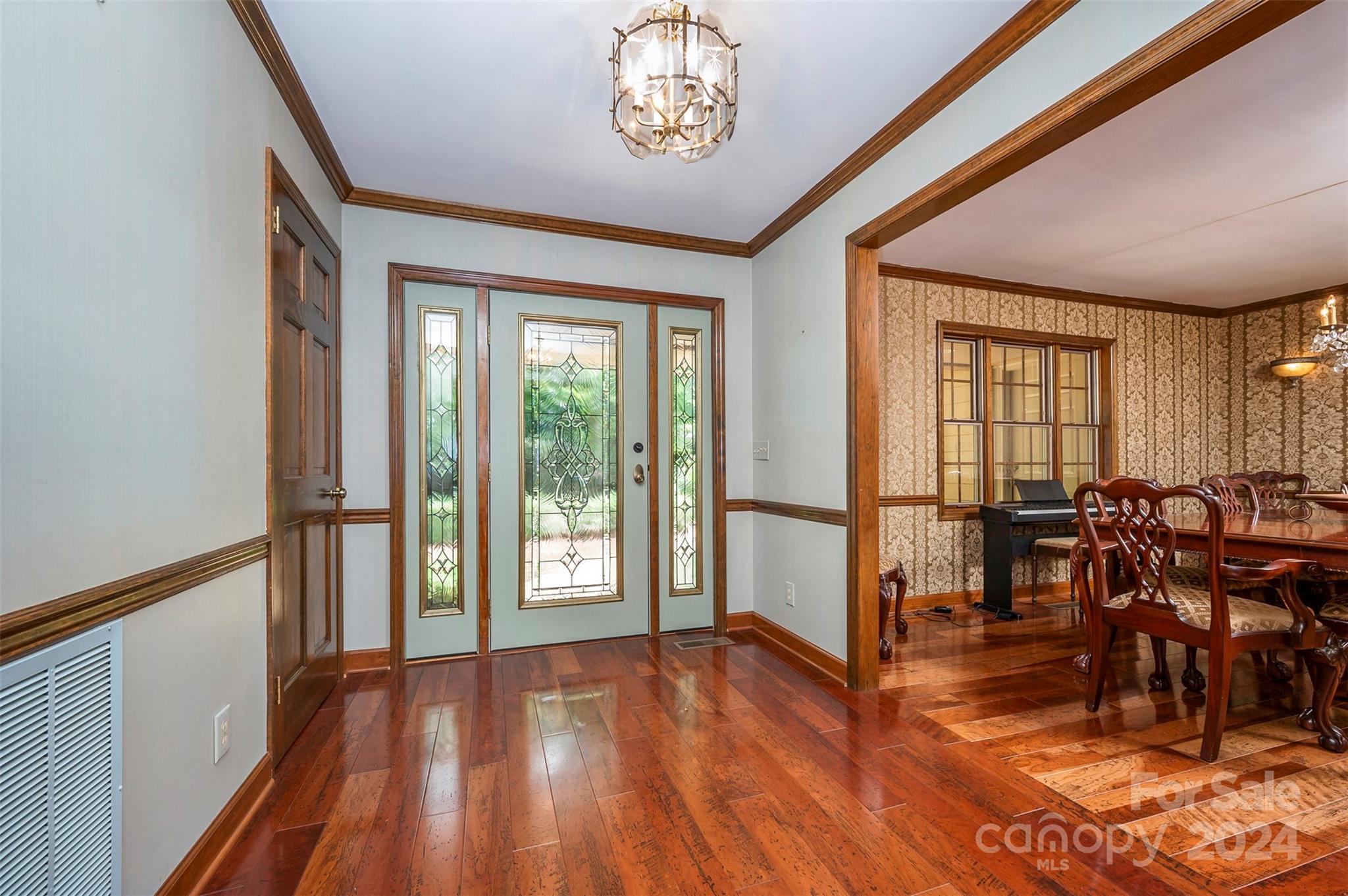 601 Ridgetop Road Tryon, NC 28782 - Photo 4 of 25 a view of a livingroom with furniture wooden floor and windows