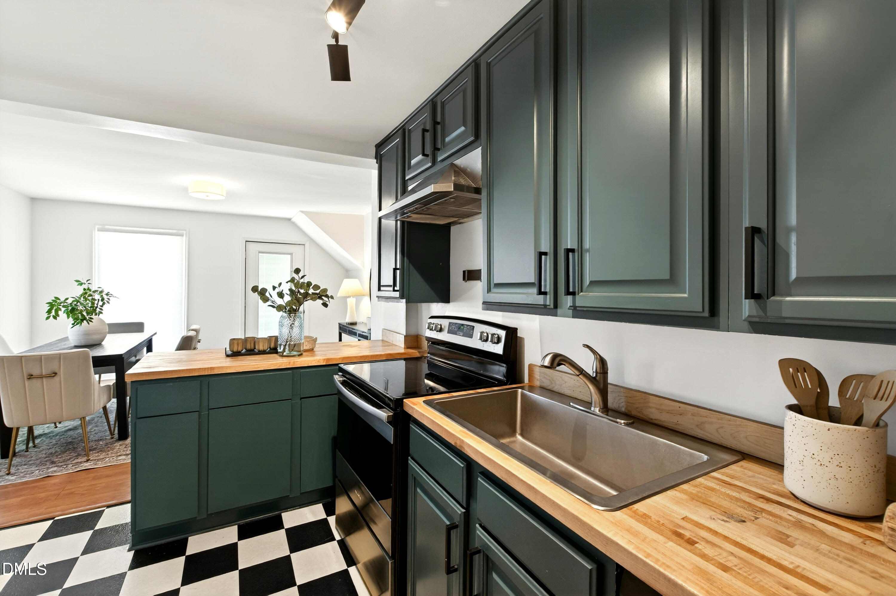 913 Washington Street Durham, NC 27701 - Photo 5 of 37 a kitchen with a sink and a stove top oven