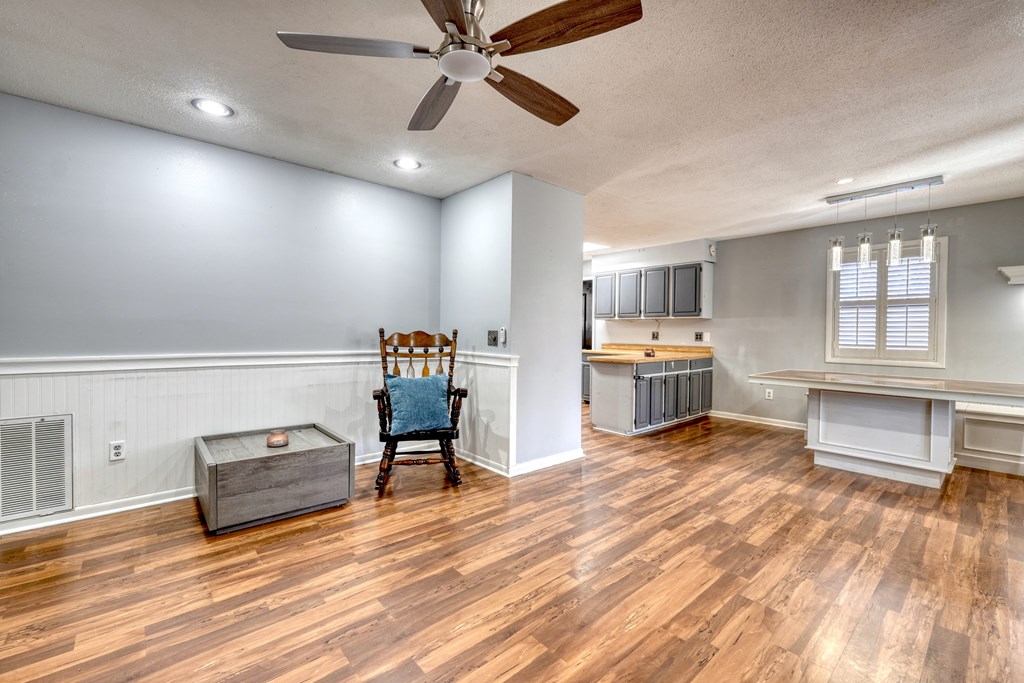 131 Hickory Ridge Circle Hayesville, NC 28904 - Photo 14 of 35 a living room with furniture and a wooden floor