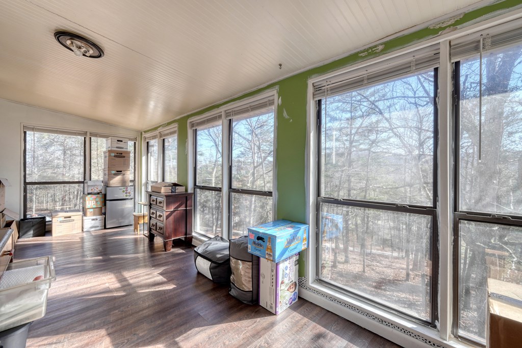 131 Hickory Ridge Circle Hayesville, NC 28904 - Photo 17 of 35 a living room with furniture and a large window