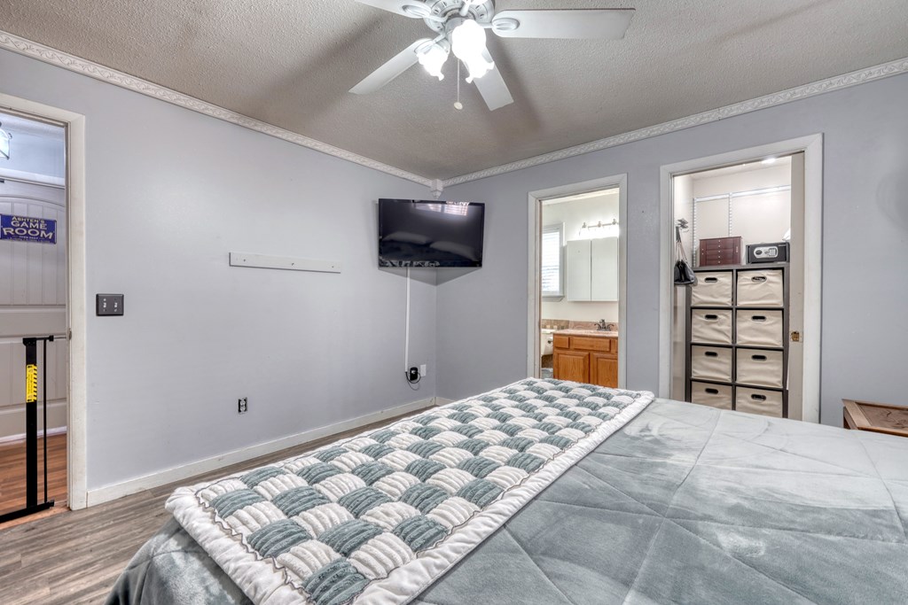 131 Hickory Ridge Circle Hayesville, NC 28904 - Photo 19 of 35 a bedroom with a bed and a flat screen tv